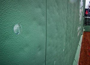 A baseball tattooed on the Green Monster. Stan Grossfeld/The Boston Globe