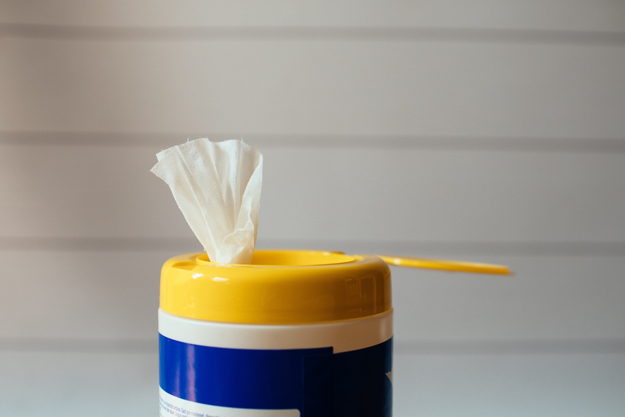 Disinfecting wipes in a container